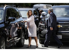 Canada's Foreign Affairs Minister Chrystia Freeland, left, walks to a car during a break in trade talk negotiations from the Office of the United States Trade Representative, Thursday, Aug. 30, 2018, in Washington. At right is David MacNaughton, Canada's Ambassador to the United States.