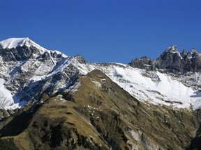 FILE - In this Oct. 10, 2005 photo Mount Piz Segnas, left, and the Tschingel Horn mountains, right, with the Martin's Hole near Elm in the canton of Glarus, are pictured in Switzerland. Police in southeastern Graubuenden canton (state) said a several-seater plane crashed Saturday on the Piz Segnas mountain above the Swiss Alpine resort of Flims, striking the mountain's western flank about 2,540 meters (8,330 feet) above sea level. There was no immediate word on casualties.