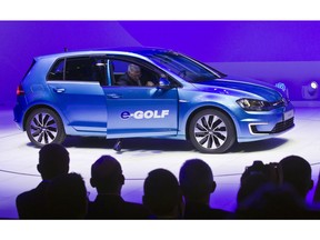 FILE - In this Jan 13, 2014 file photo the Volkswagen e-Golf fully electric vehicle is presented at the North American International Auto Show in Detroit, Michigan. Volkswagen said Thursday, Aug. 23, 2018 it is planning a new e-car-sharing project and will invest in car connectivity.