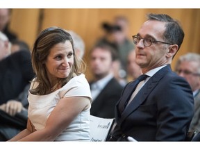 Canadian Foreign Minister Chrystia Freeland, left, looks to German Foreign Minister Heiko Maas as she participates in a meeting of German ambassadors in Berlin Monday, Aug. 27, 2018.