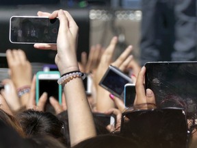 Teens at a music festival in Toronto. People born in 2001 will turn 18 next year, meaning many will enter university, be eligible to vote and, depending on their citizenship, smoke or drink alcohol without breaking the law.