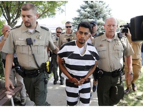 Cristhian Bahena Rivera is escorted into the Poweshiek County Courthouse for his initial court appearance, Wednesday, Aug. 22, 2018, in Montezuma, Iowa. Rivera is charged with first-degree murder in the death of Mollie Tibbetts, who disappeared July 18 from Brooklyn, Iowa.