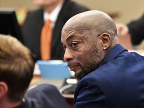 FILE - In this July, 9, 2018, file photo, plaintiff DeWayne Johnson looks up during a brief break as the Monsanto trial continues in San Francisco. Monsanto is being accused of hiding the dangers of its popular Roundup products. A San Francisco jury on Friday, Aug. 10, 2018, ordered agribusiness giant Monsanto to pay $289 million to a former school groundskeeper dying of cancer, saying the company's popular Roundup weed killer contributed to his disease.