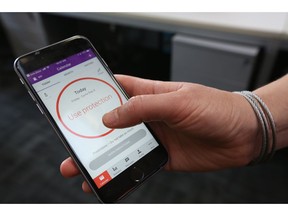A women demonstrates using the Natural Cycles smartphone app,  in London, Friday, Aug. 17, 2018.  The mobile fertility app, has become the first ever digital contraceptive device to win FDA (US Food and Drug Administration) marketing approval, enabling women to track their menstrual cycle and uses an algorithm to determine when they're fertile, and need to use birth control protection.