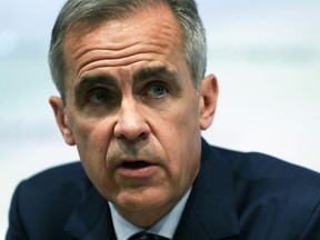 Bank of England Governor, Mark Carney, attends the central bank's quarterly Inflation Report, during a media conference in London, Thursday Aug. 2, 2018. The Bank of England raised its main interest rate for only the second time since the 2008 financial crisis, from 0.50 percent to 0.75 percent, as it weighed conflicting signs about the economy and growing concerns about Brexit.