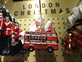 A toy double-decker bus features in a Christmas display in Selfridges in London, Monday Aug. 6, 2018. Visitors to Selfridges may be surprised to encounter Christmas trees, bright, shiny baubles and nutcrackers on display... in August. The department store claims to be the first retailer anywhere in the world to launch its Christmas Shop, excluding any year-round specialty stores.