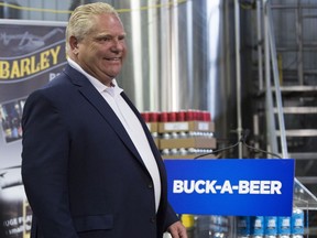Ontario Premier Doug Ford arrives for the for the buck-a-beer plan announcement at Barley Days brewery in Picton, Ont., on Tuesday Aug. 7, 2018.