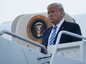 President Donald Trump arrives on Air Force One, Monday, Aug. 13, 2018, in Andrews Air Force Base, Md.