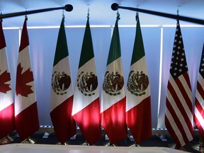 National flags representing Canada, Mexico, and the U.S.