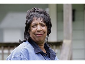 In this photo taken Wednesday, Aug. 1, 2018 Gloria Dockery is seen at her home in Durham, N.C. The 58-year-old housekeeper at UNC Chapel Hill works third shift, owns a house and has worked as a housekeeper for 19 years. While the Democratic strongholds of New York and California have started a multi-year effort to raise the minimum wage to $15 an hour, the Republican-controlled legislature of North Carolina jumped to the front of the "living wage" line in one swoop last month, at least for state workers. GOP legislators passed a budget law that requires all permanent state government workers to get paid the equivalent of $31,200 a year.