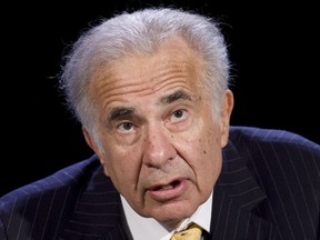 FILE - In this Oct. 11, 2007 file photo, activist investor Carl Icahn speaks at the World Business Forum in New York.   Shares of Express Scripts rose in early trading Tuesday, Aug. 14, 2018,  after Icahn ended his short-lived fight to scuttle Cigna's takeover of the pharmacy benefit manager. Icahn said late Monday that he will no longer try to convince other shareholders to vote against the roughly $52-billion deal later this month. He noted that two prominent shareholder advisory firms support it and that there is significant stockholder overlap between the companies.