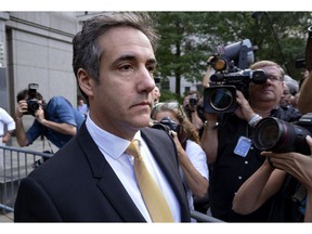 FILE - In this Aug. 21, 2018 file photo, Michael Cohen, former personal lawyer to President Donald Trump, leaves federal court after reaching a plea agreement in New York. Investigators in New York state issued a subpoena to Cohen as part of their probe into the Trump Foundation, an official with Democratic Gov. Andrew Cuomo's administration confirmed to The Associated Press on Wednesday, Aug. 22.