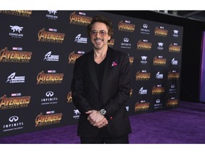 FILE - In this April 23, 2018, file photo, Robert Downey Jr. arrives at the world premiere of "Avengers: Infinity War" in Los Angeles. George Clooney tops the 2018 Forbes' list of highest-paid actors with $239 million in pretax earnings. Downey Jr. was third with $81 million.