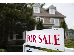 FILE- In this June 8, 2018, file photo a for sale sign stands in front of a house, in Jenkintown, Pa. On Tuesday, Aug. 28, the Standard & Poor's/Case-Shiller 20-city home price index for June is released.