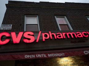 FILE- This Dec. 3, 2017, file photo shows a CVS Pharmacy in the Brooklyn borough of New York. CVS Health reports earnings Wednesday, Aug. 8, 2018.