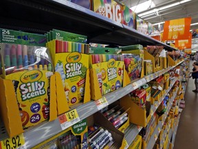 FILE- This July 19, 2018, file photo shows a display of scented markers and crayons in a Walmart in Pittsburgh. Walmart Inc. reports earnings on Thursday, Aug. 16.