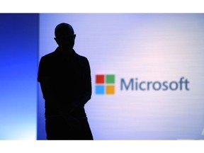 FILE- In this May 7, 2018, file photo Microsoft CEO Satya Nadella looks on during a video as he delivers the keynote address at Build, the company's annual conference for software developers in Seattle. Microsoft is requesting the Federal Election Commission's advisory opinion to make sure Microsoft's new free package of online account security protections for "election-sensitive" customers doesn't count as in-kind campaign contributions.
