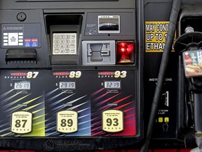 FILE- In this June 14, 2018, file photo,  gasoline prices are displayed on a pump at Sheetz along the Interstate 85 and 40 corridor near Burlington, N.C. On Friday, Aug. 10, the Labor Department reports on U.S. consumer prices for July.