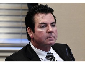 FILE - In this Oct. 18, 2017, file photo, Papa John's founder and CEO John Schnatter attends a meeting in Louisville, Ky. Schnatter filed the lawsuit in Delaware's Court of Chancery asking the court to help stop what he sees as irreparable harm being done to the company. Schnatter resigned in July as Papa John's chairman after a report that he used a racial slur during a media training session. But he remains the Louisville, Kentucky-based company's biggest shareholder.