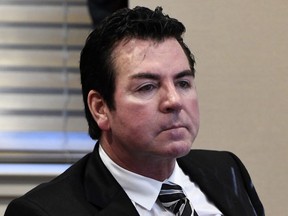 FILE - In this Wednesday, Oct. 18, 2017, file photo, Papa John's founder and CEO John Schnatter attends a meeting in Louisville, Ky. Schnatter says the pizza chain needs him back as its public face, and that it was a mistake for the company to scrub him from its marketing materials after he acknowledged using a racial slur last month.
