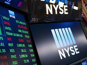 FILE- In this May 10, 2018, file photo, stock screens are shown at the New York Stock Exchange. The U.S. stock market opens at 9:30 a.m. EDT on Monday, Aug 14.