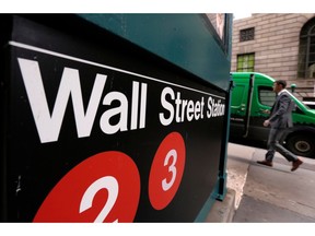 FILE- In this April 5, 2018, file photo a sign for a Wall Street subway station is shown. The U.S. stock market opens at 9:30 a.m. EDT on Tuesday, Aug. 28.