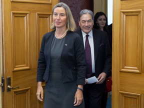 European Union foreign policy chief Federica Mogherini, left, and  New Zealand Foreign Minister Winston Peters arrive for a press conference after their meeting at Parliament in Wellington, New Zealand, Tuesday, Aug. 7, 2018. Mogherini said the EU is encouraging enterprises to increase their business with Iran, as that country has been compliant with their nuclear-related commitments.