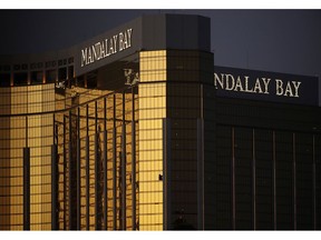 FILE - In this Oct. 3, 2017, file photo, windows of a room are broken after a high-stakes gambler opened fire on a concert below in a mass shooting from the Mandalay Bay resort and casino in Las Vegas. Stadiums, corporate buildings and other facilities that draw crowds have strengthened their security since 9/11 and earned U.S. protections if their efforts fail to prevent a terrorist attack and they are sued. But hotels, including Las Vegas' world-famous casino-resorts, have not received the same safeguards.
