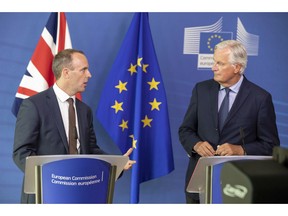 Britain's Secretary of State for Exiting the European Union Dominic Raab, left, and EU chief Brexit negotiator Michel Barnier hold a press conference at EU headquarters in Brussels on Tuesday, Aug. 21, 2018.