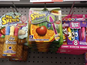 This July 18, 2018, photo shows a display of scented markers and crayons in a Staples in Pittsburgh. Scented pencils and markers are among the hot items in the school supplies aisle this year.