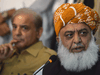 Pakistani opposition leader Maulana Fazalur Rehman, right, and Shahbaz Sharif, left, the younger brother of ousted Pakistani prime minister Nawaz Sharif and head of Pakistan Muslim League-Nawaz (PML-N), at a protest demanding new elections following allegations of rigging in the polls.