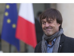 FILE - In this Thursday, Dec. 6, 2012 file photo, environmental activist Nicolas Hulot, smiles as he leaves the Elysee Palace in Paris, France. France's high-profile environment minister, former TV personality Nicolas Hulot, has unexpectedly announced his resignation live on national radio, dealing a blow to the lofty green ambitions of President Emmanuel Macron.