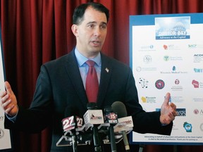 FILE - In this Jan. 30, 2018, file photo, Wisconsin Gov. Scott Walker speaks at a news conference in Madison, Wis. Eight Democrats are taking on Walker in the Tuesday, Aug. 14, 2018, as he seeks a third term, a sign of just how badly the party wants to dethrone one of the GOP's most recognizable governors.