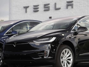 Electric car maker Tesla Motors Canada ULC took the Ontario government to court, claiming it has been treated unfairly in the government's decision to cancel an electric vehicle rebate.