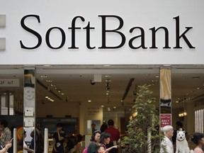 This June 14, 2018, photo, shows the logo of Japanese mobile provider SoftBank at its shop in Tokyo. Japanese technology company SoftBank said Monday, Aug 6, 2018, its profits grew to 313.7 billion yen ($2.8 billion) in the latest quarter as it realized gains from sales by its Softbank Vision investment fund.
