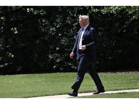 President Donald Trump walks from the Oval Office as he leaves the White House in Washington, Friday, Aug. 31, 2018, for a trip to Charlotte, N.C.