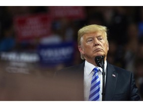 President Donald Trump takes the stage at a rally in support of the Senate candidacy of West Virginia's Attorney General Patrick Morrisey, Tuesday, Aug. 21, 2018, at the Charleston Civic Center in Charleston, W.Va.