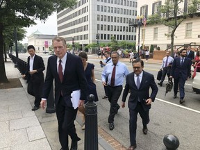 United States Trade Representative Robert Lighthizer, front left, and Mexican Secretary of Economy Idelfonso Guajardo, front right, walk to the White House on Monday August 27, 2018. President Donald Trump says the prospects are "looking good" for an agreement with Mexico that could set the stage for an overhaul of the North American Free Trade Agreement.