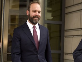 FILE - In this Feb. 23, 2018, file photo, Rick Gates leaves federal court in Washington. Paul Manafort's trial opened this week with a display of his opulent lifestyle and testimony about what prosecutors say were years of financial deception. But the most critical moment in the former Trump campaign chairman's financial fraud trial will arrive next week with the testimony of his longtime associate Gates.