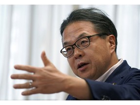 Japan's Trade Minister Hiroshige Seko speaks during an exclusive interview with The Associated Press at his office in Tokyo Thursday, Aug. 23, 2018. Seko criticized President Donald Trump's tariff policies as based on a serious misunderstanding about the importance of free trade and the contributions of Japanese companies to the U.S. economy.