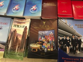 This Aug. 15, 2018, photo shows the "2018 Korea Commodities" catalog, produced by the North's Committee for the Promotion of International Trade, at a bookstore in a hotel in Pyongyang, North Korea. North Korea now has an official shopper's guide that's glossy, is full of testimonials from satisfied customers and even lists phone numbers and email contact details for the dozens of companies pitching their latest products - though good luck getting through to any of them.