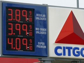 FILE - In this Feb. 24, 2012 file photo, gas prices are posted at the Citgo gas station in Philadelphia. A Canadian gold mining company on Thursday, Aug. 9, 2018 won the right to go after Venezuela's prized U.S.-based oil refineries and collect $1.4 billion it lost in a decade-old take-over by the late socialist President Hugo Chavez.