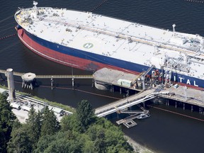 A aerial view of Kinder Morgan's Trans Mountain marine terminal filling a oil tanker in Burnaby, B.C.