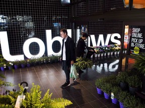 A man leaves a Loblaws store in Toronto on Thursday, May 3, 2018. The company says George Weston Ltd. will receive its 61.6 per cent interest in Choice Properties REIT and Loblaw's minority shareholders will receive George Weston shares in exchange.