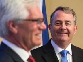 U.K. secretary of state for international trade Liam Fox, right, meets with his Canadian counterpart, Jim Carr in Ottawa.