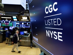 The logo for Canada's Canopy Growth Corp. appears on a screen above a trading post on the floor of the New York Stock Exchange.