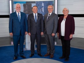 Minister and Liberal party leader Philippe Couillard (left), Coalition Avenir Quebec party leader Francois Legault, Quebecers Party leader Jean-Fracois Lisse and member of Quebec Solidary party Manon Masse gather before the final Quebec leadership debate.