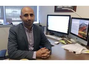 Dr. Fatta Nahab, a neurologist who directs the Functional Imaging of Neurodegenerative Disorders Lab at the University of California San Diego Health's Movement Disorder Center, sits at his desk Monday, Sept 17, 2018, in San Diego. Nahab spent years going through regulatory hoops to get approval to import marijuana from Canada, to study whether cannabis can help treat essential tremor, a shaking condition affecting millions of people.