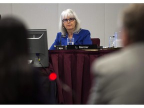 Lyne Mercier listens to presentations at the National Energy Board hearings into the Enbridge Pipelines proposals Thursday, October 10, 2013 in Montreal. The National Energy Board has named the panel that will conduct its reconsideration of the Trans Mountain expansion project. The board has assigned Lyne Mercier, Alison Scott and Murray Lytle to the panel.THE CANADIAN PRESS/Ryan Remiorz