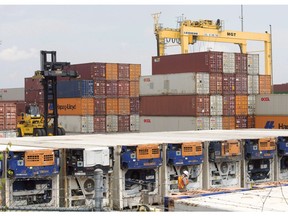 Containers are unloaded at the Port of Montreal Thursday, July 20, 2017 in Montreal.